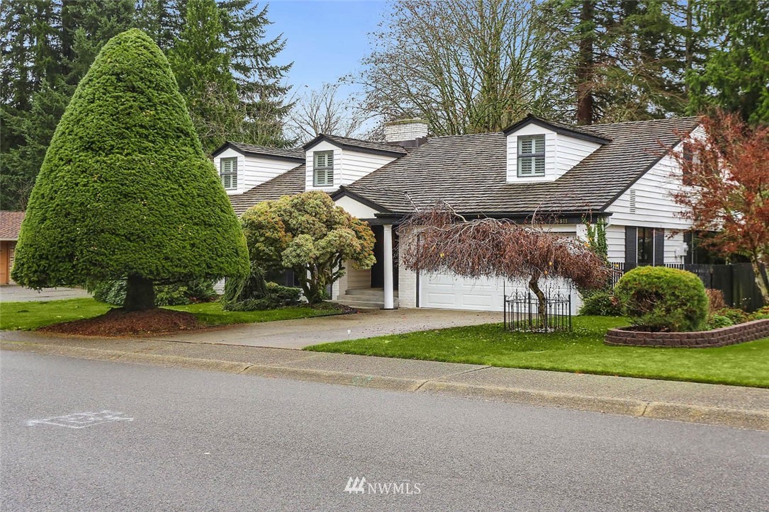14811 Southeast 172nd Place Renton, WA 98058 - Photo 24 of 24 a front view of a house with a yard and garage