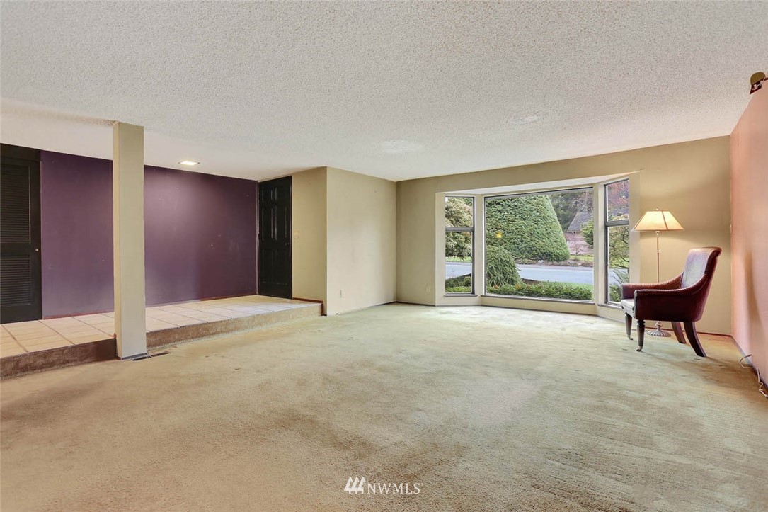 14811 Southeast 172nd Place Renton, WA 98058 - Photo 4 of 24 a view of a livingroom with furniture and a large window