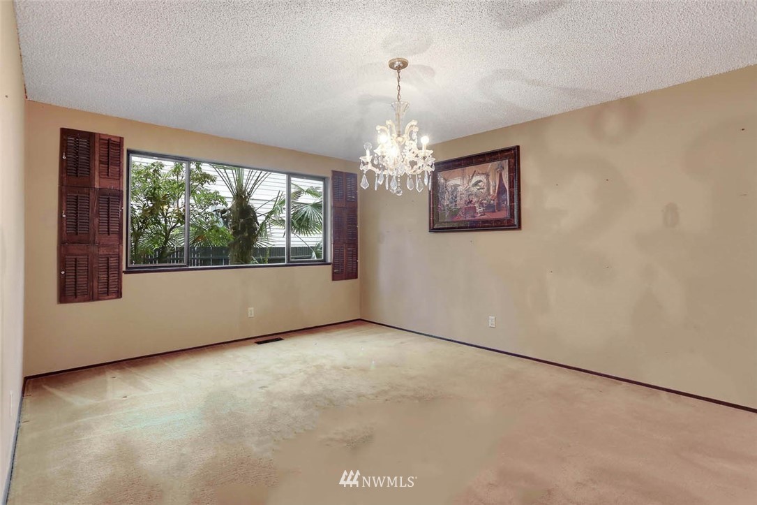 14811 Southeast 172nd Place Renton, WA 98058 - Photo 6 of 24 an empty room with windows and outdoor view