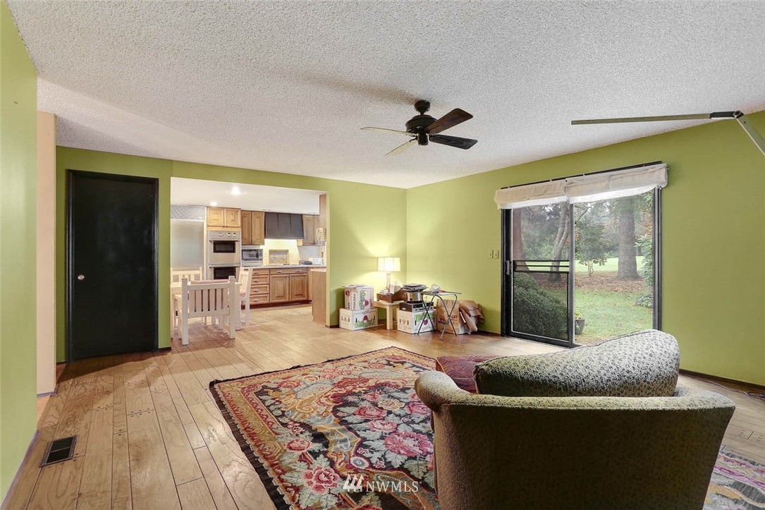 14811 Southeast 172nd Place Renton, WA 98058 - Photo 8 of 24 a living room with furniture and a rug