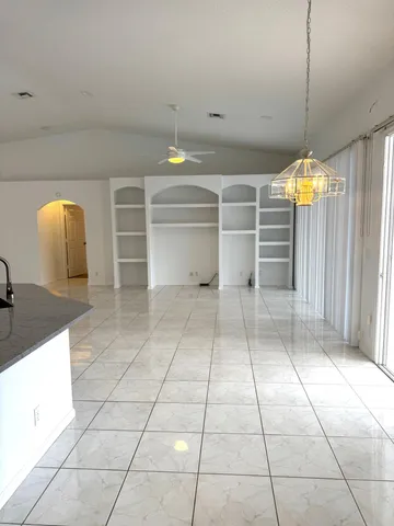 a view of a kitchen with a sink and cabinets