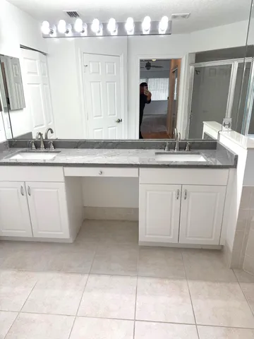 a bath tub sitting in a bathroom next to a window