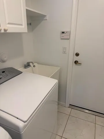 a view of a swimming pool with a yard