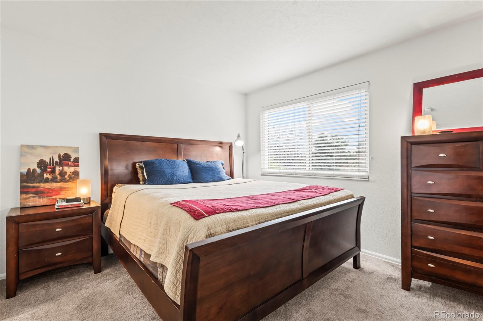 8450 Decatur Street, Unit 98 Westminster, CO 80031 - Photo 13 of 23 a bedroom with a bed and a dresser