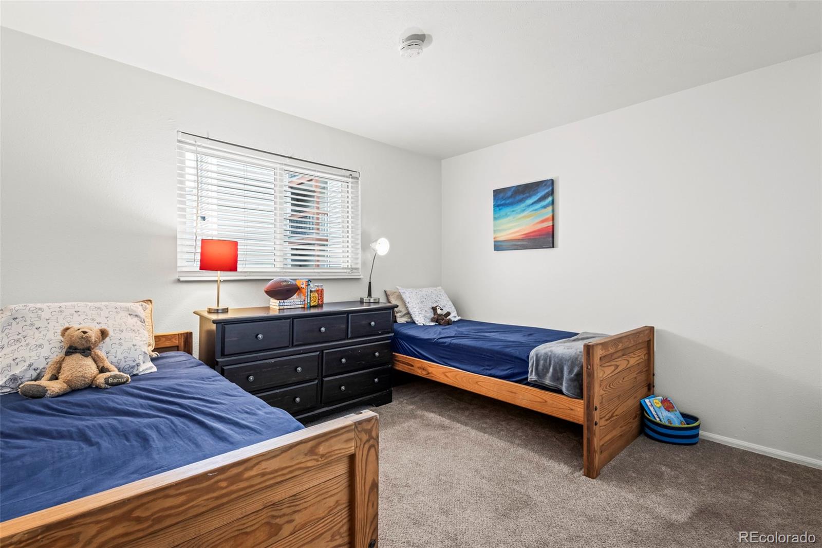 8450 Decatur Street, Unit 98 Westminster, CO 80031 - Photo 16 of 23 a bedroom with furniture and a window