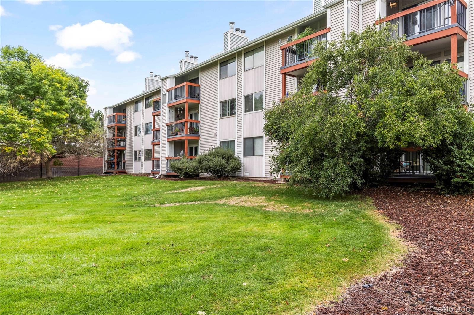 8450 Decatur Street, Unit 98 Westminster, CO 80031 - Photo 22 of 23 a view of a building with a yard