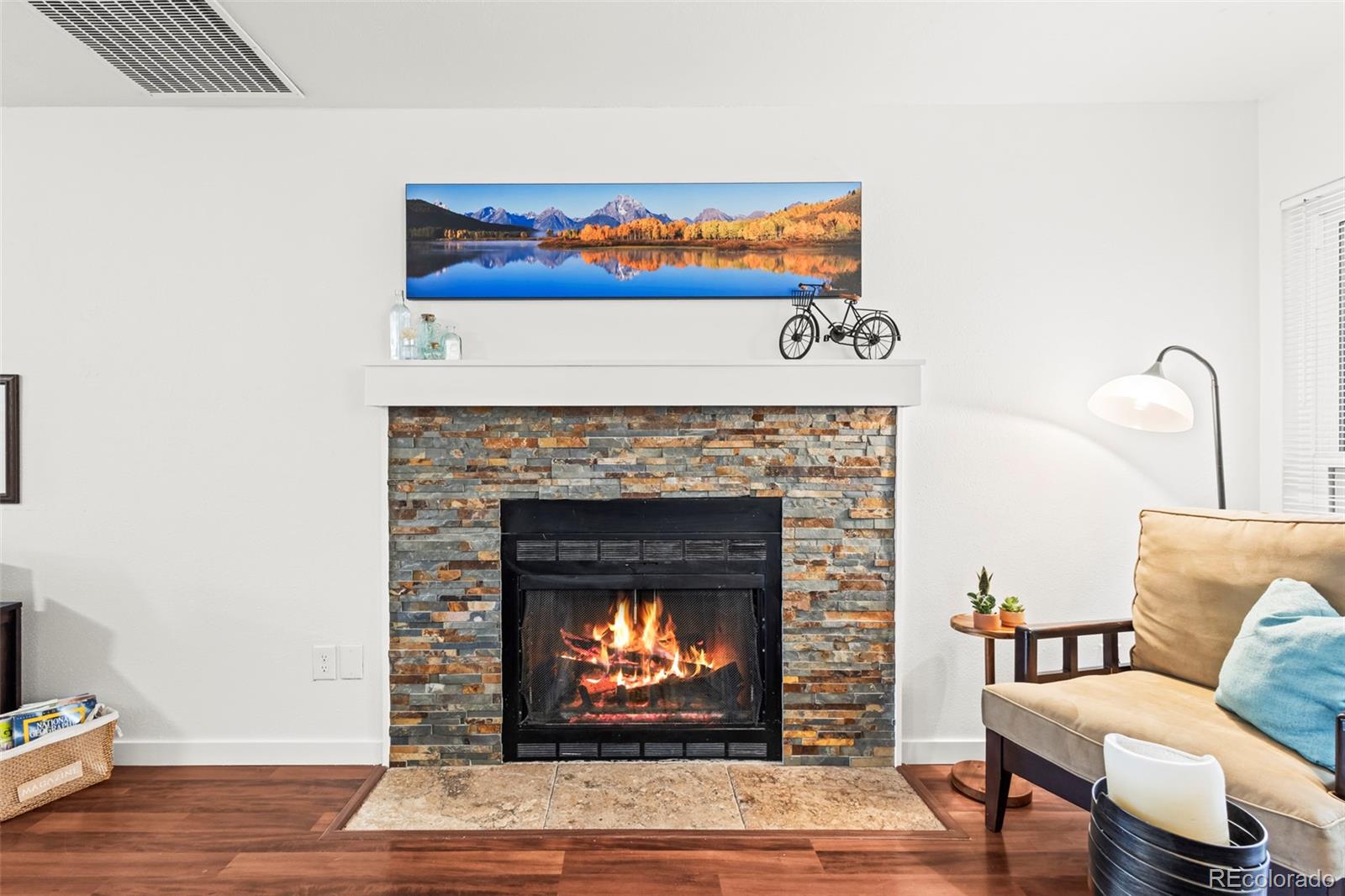 8450 Decatur Street, Unit 98 Westminster, CO 80031 - Photo 3 of 23 a living room with furniture and a fireplace