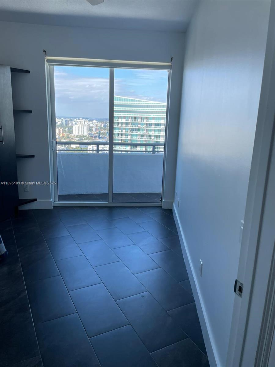 60 Southwest 13th Street, Unit 3426 Miami, FL 33130 - Photo 14 of 32 a view of an empty room with a window