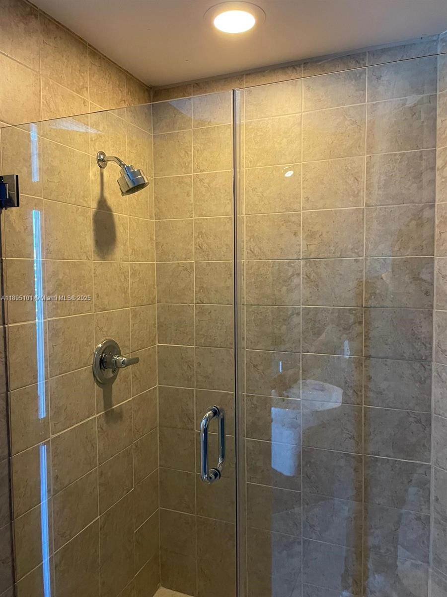 60 Southwest 13th Street, Unit 3426 Miami, FL 33130 - Photo 17 of 32 a bathroom with a shower