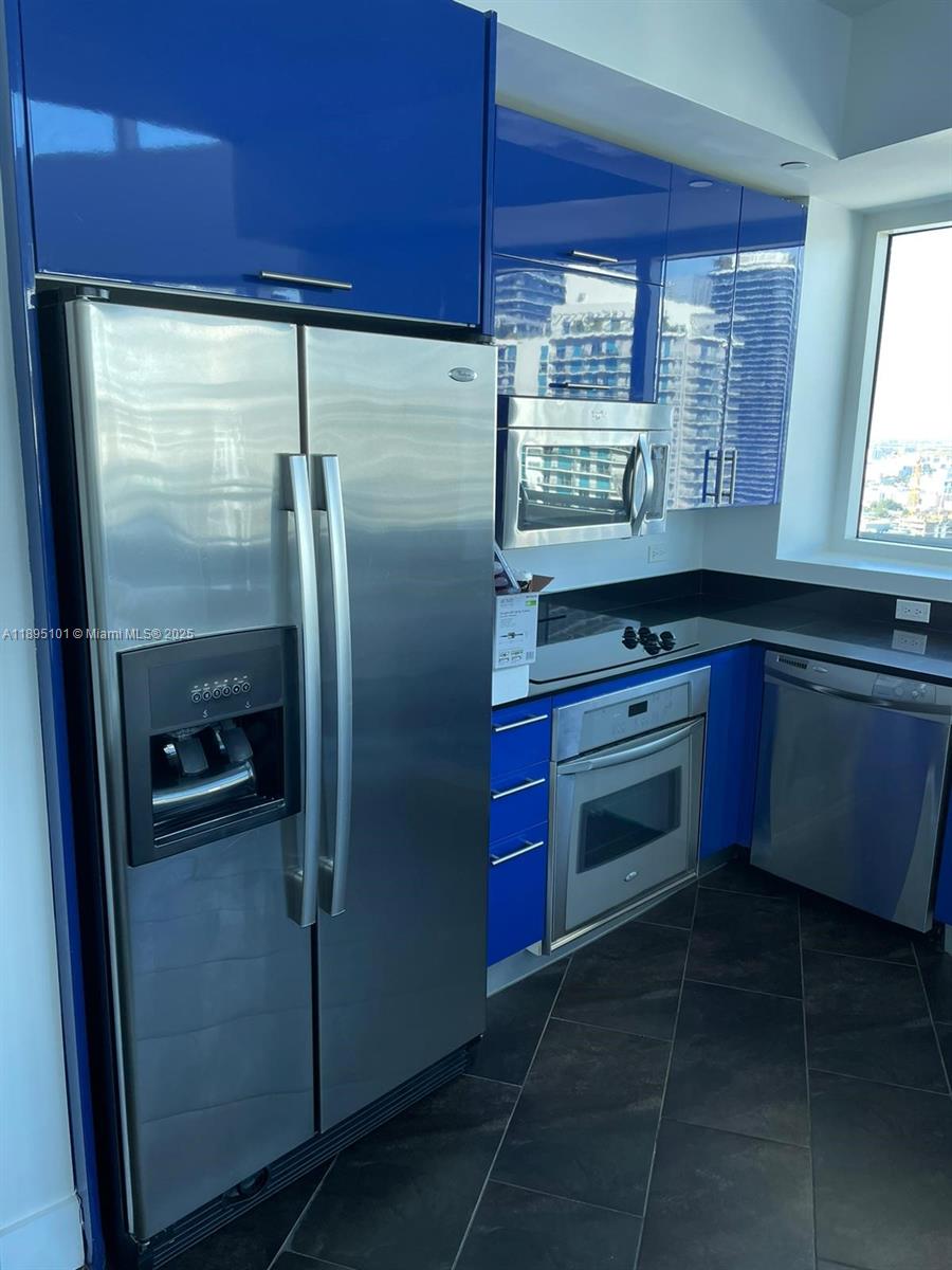 60 Southwest 13th Street, Unit 3426 Miami, FL 33130 - Photo 29 of 32 a kitchen with stainless steel appliances granite countertop a refrigerator a sink a stove and a refrigerator