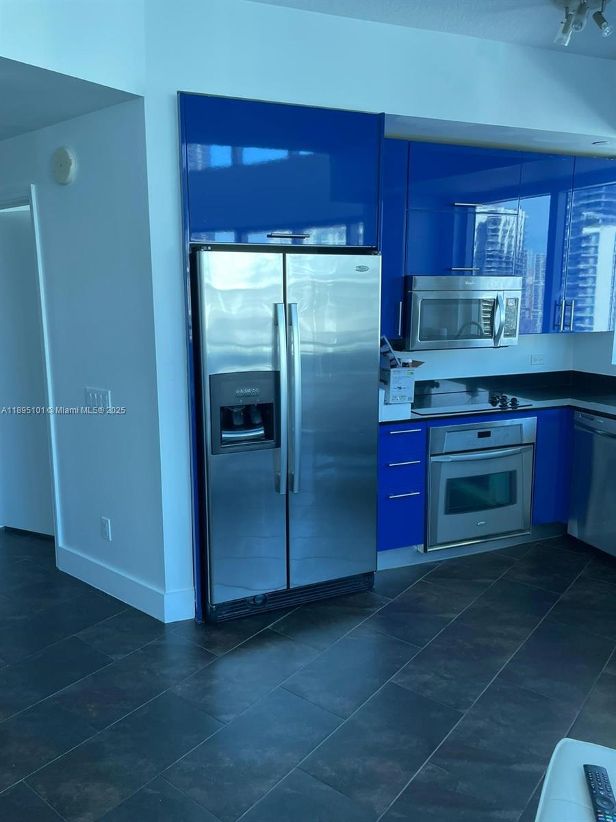 60 Southwest 13th Street, Unit 3426 Miami, FL 33130 - Photo 9 of 32 a kitchen with stainless steel appliances granite countertop a refrigerator and a sink