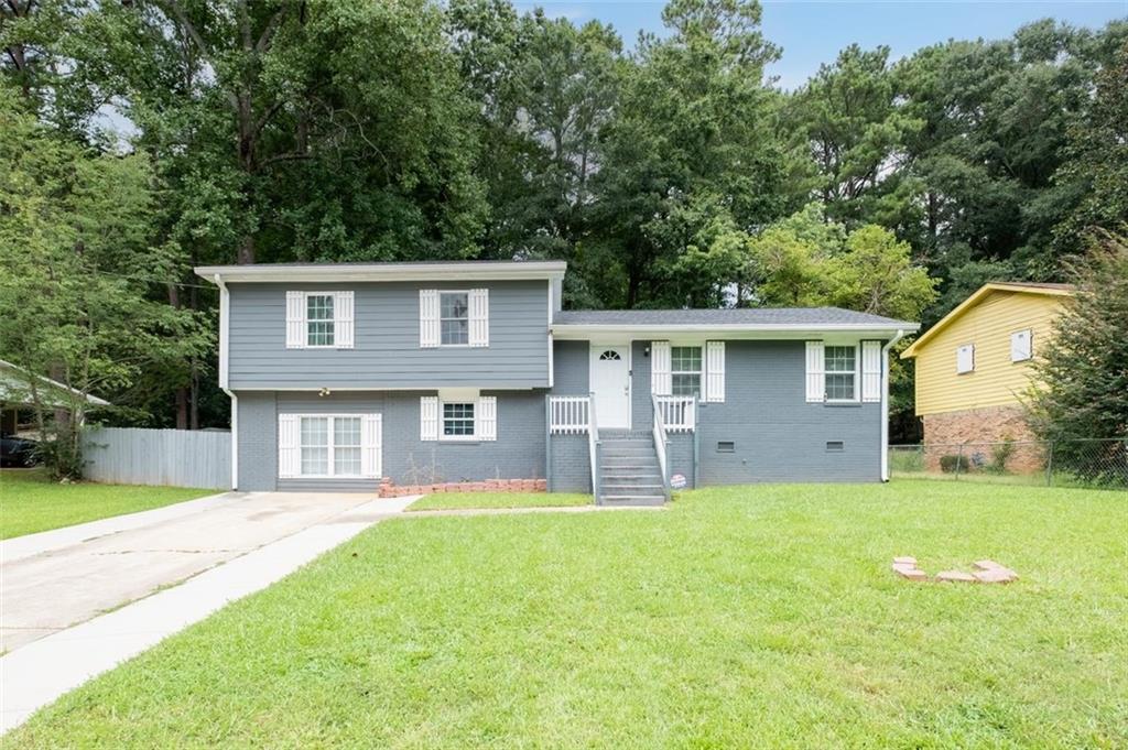 4064 Emerald N Drive Decatur, GA 30035 - Photo 1 of 1 a view of a house with a big yard and large tree