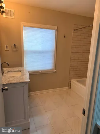 a bathroom with a sink a vanity and a mirror