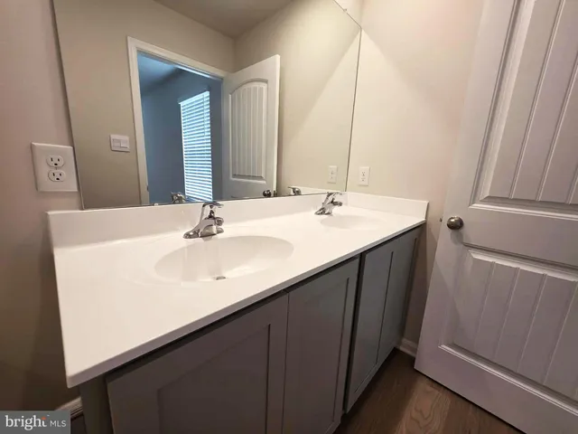 a white toilet sitting next to a bath tub and a shower