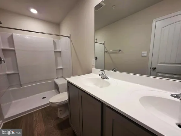 a view of a room with shelf on the wall