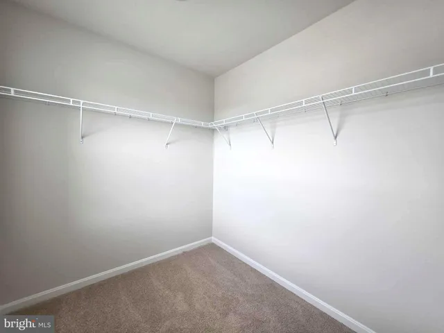a bathroom with a sink toilet and a mirror