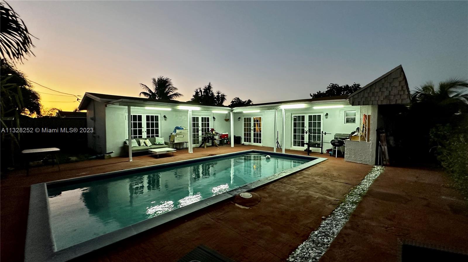 7810 Raleigh Street Hollywood, FL 33024 - Photo 1 of 16 a view of a house with a balcony