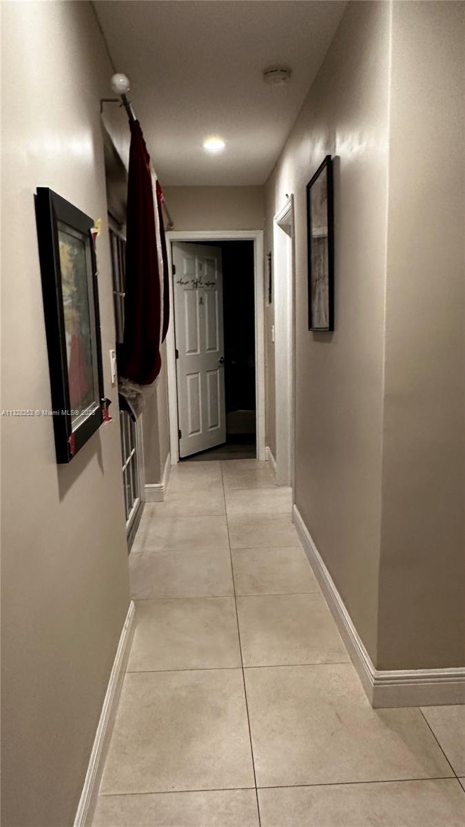 7810 Raleigh Street Hollywood, FL 33024 - Photo 13 of 16 a view of entryway with wooden floor