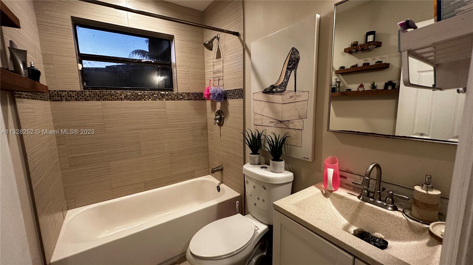 7810 Raleigh Street Hollywood, FL 33024 - Photo 15 of 16 a bathroom with a sink toilet and shower