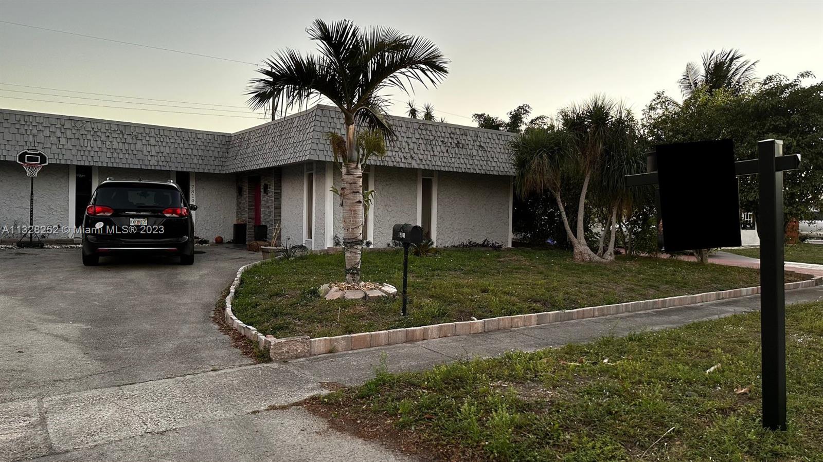7810 Raleigh Street Hollywood, FL 33024 - Photo 3 of 16 a house view with a garden space