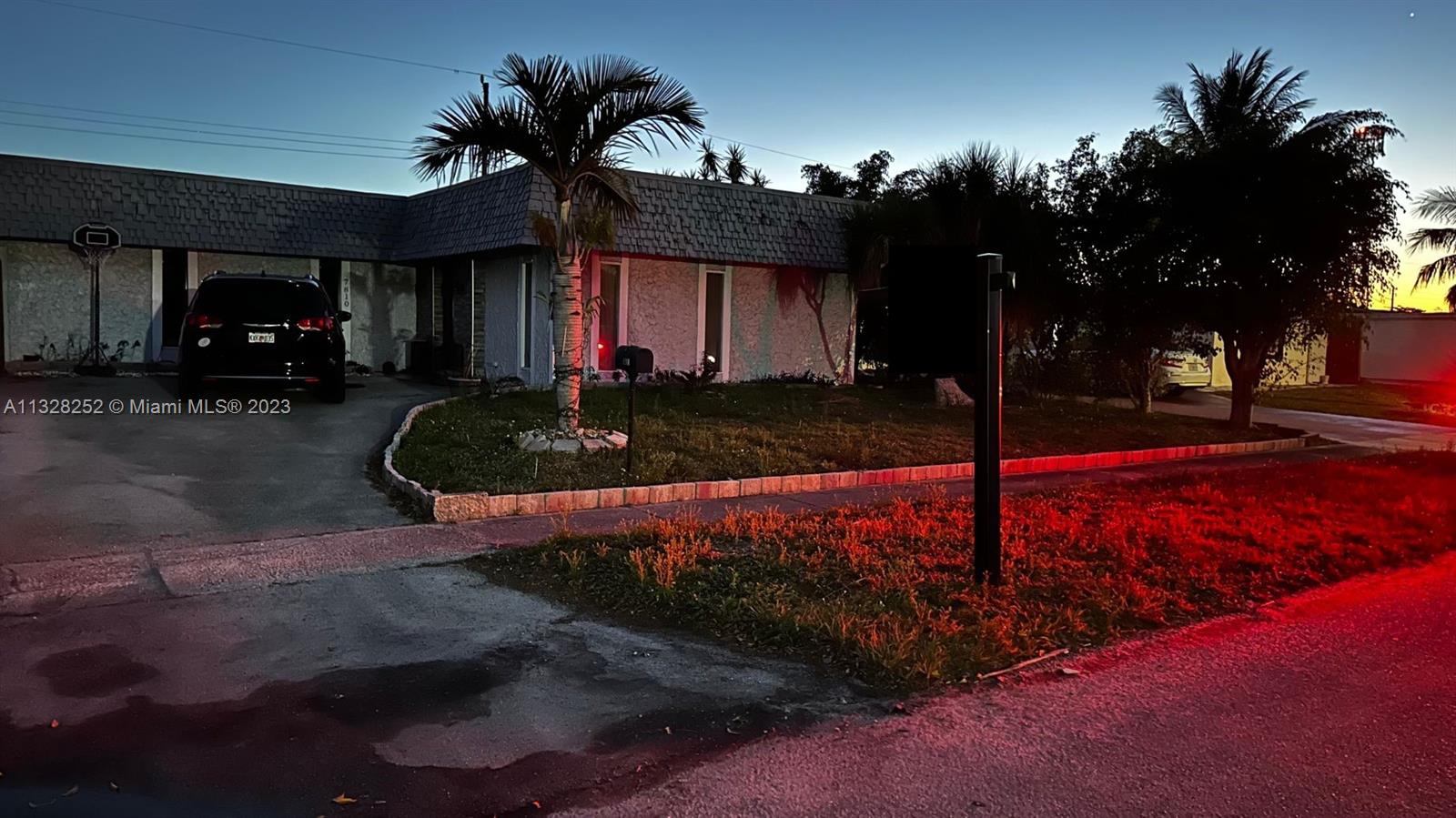 7810 Raleigh Street Hollywood, FL 33024 - Photo 5 of 16 a front view of a house with garden