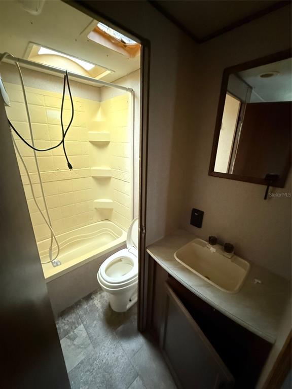 3000 Clarcona Road, Unit 505 Apopka, FL 32703 - Photo 6 of 10 a bathroom with a sink toilet and shower