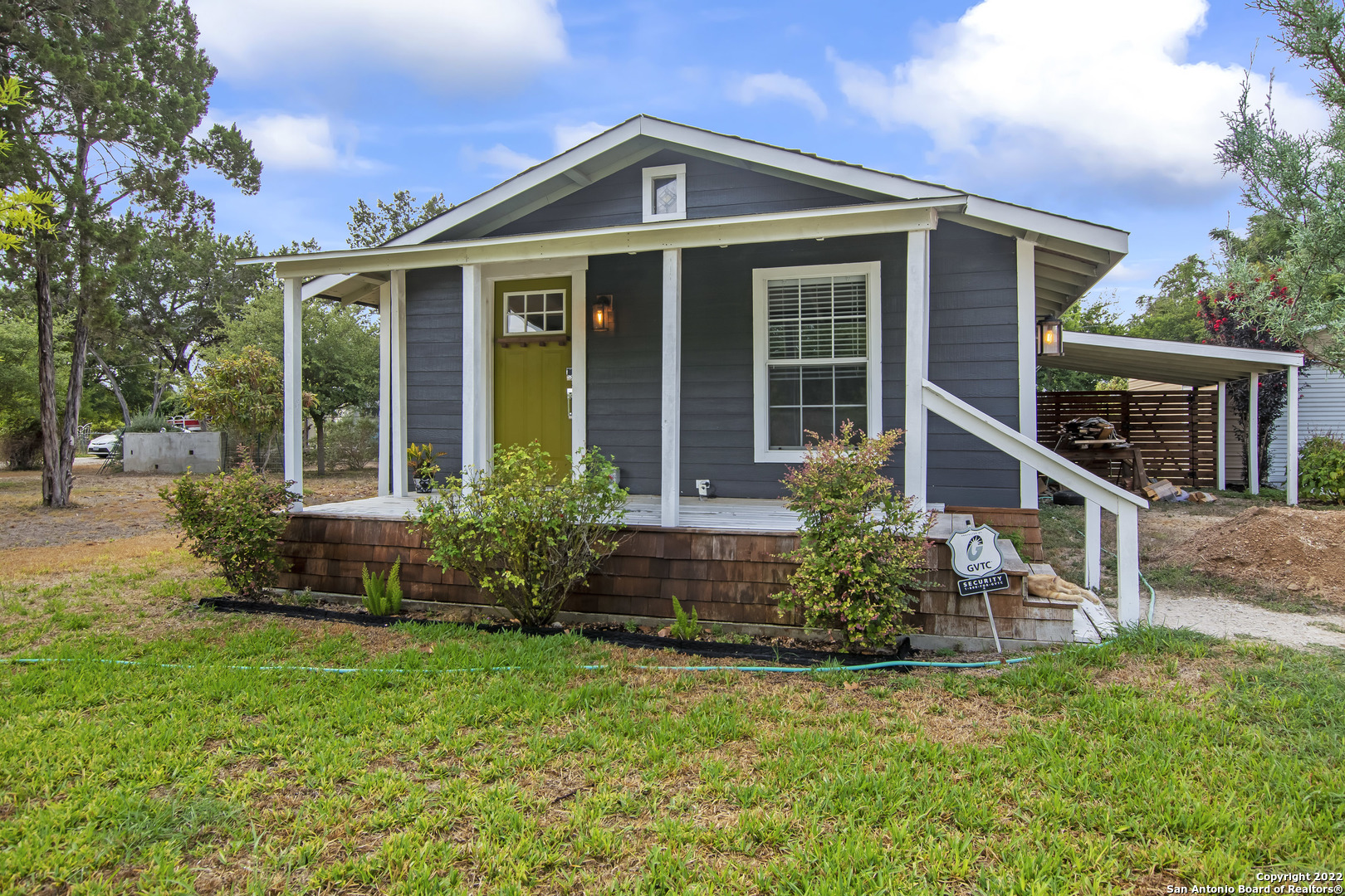 front view of a house with a yard