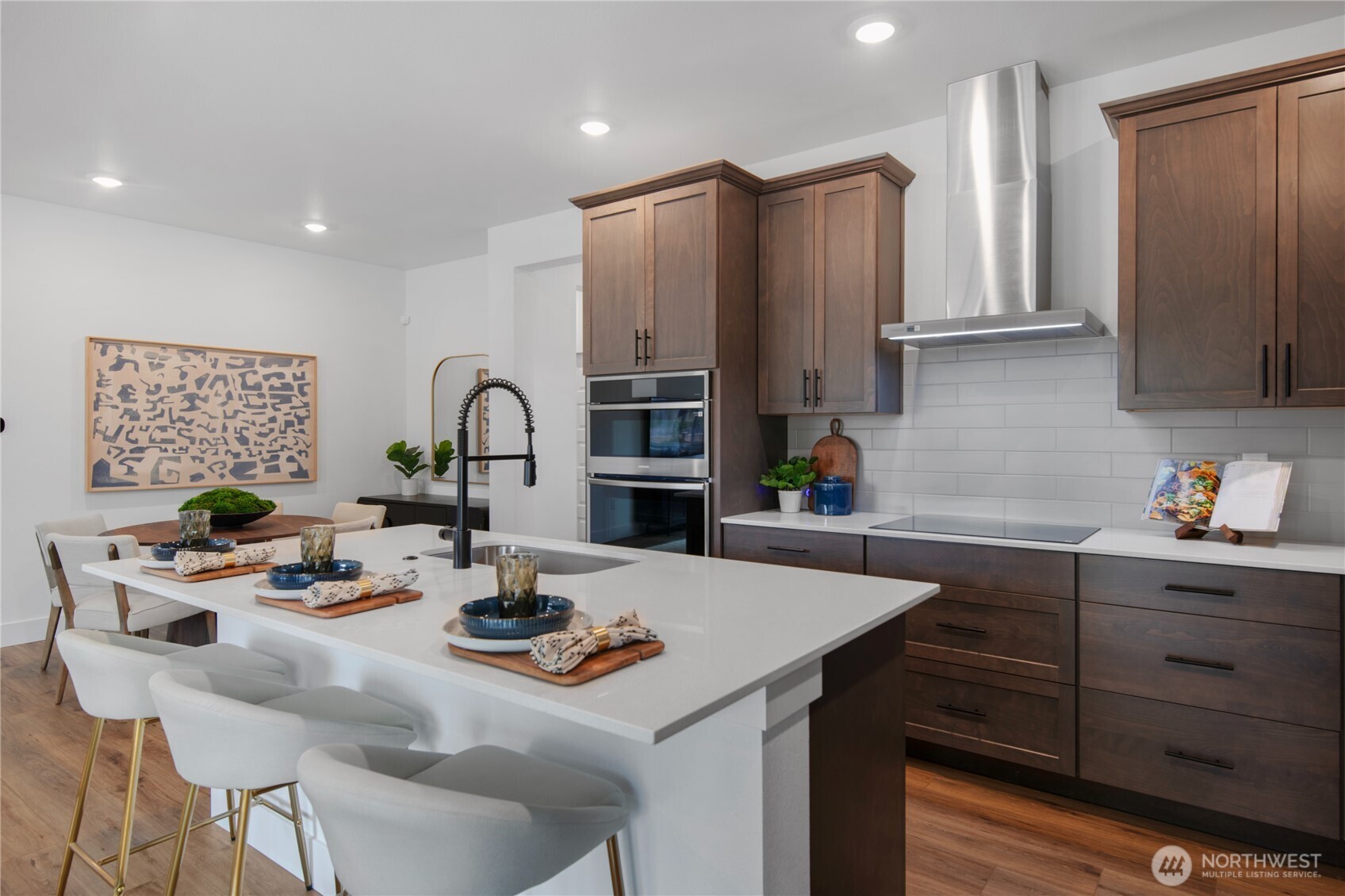 592 Sunbeam Place Sequim, WA 98382 - Photo 5 of 23 a kitchen with stainless steel appliances a sink a table and chairs