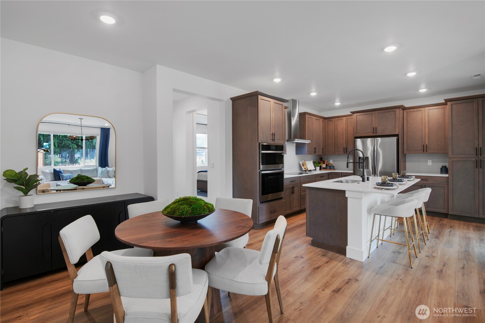 592 Sunbeam Place Sequim, WA 98382 - Photo 6 of 23 a view of a dining room with furniture a kitchen and chandelier