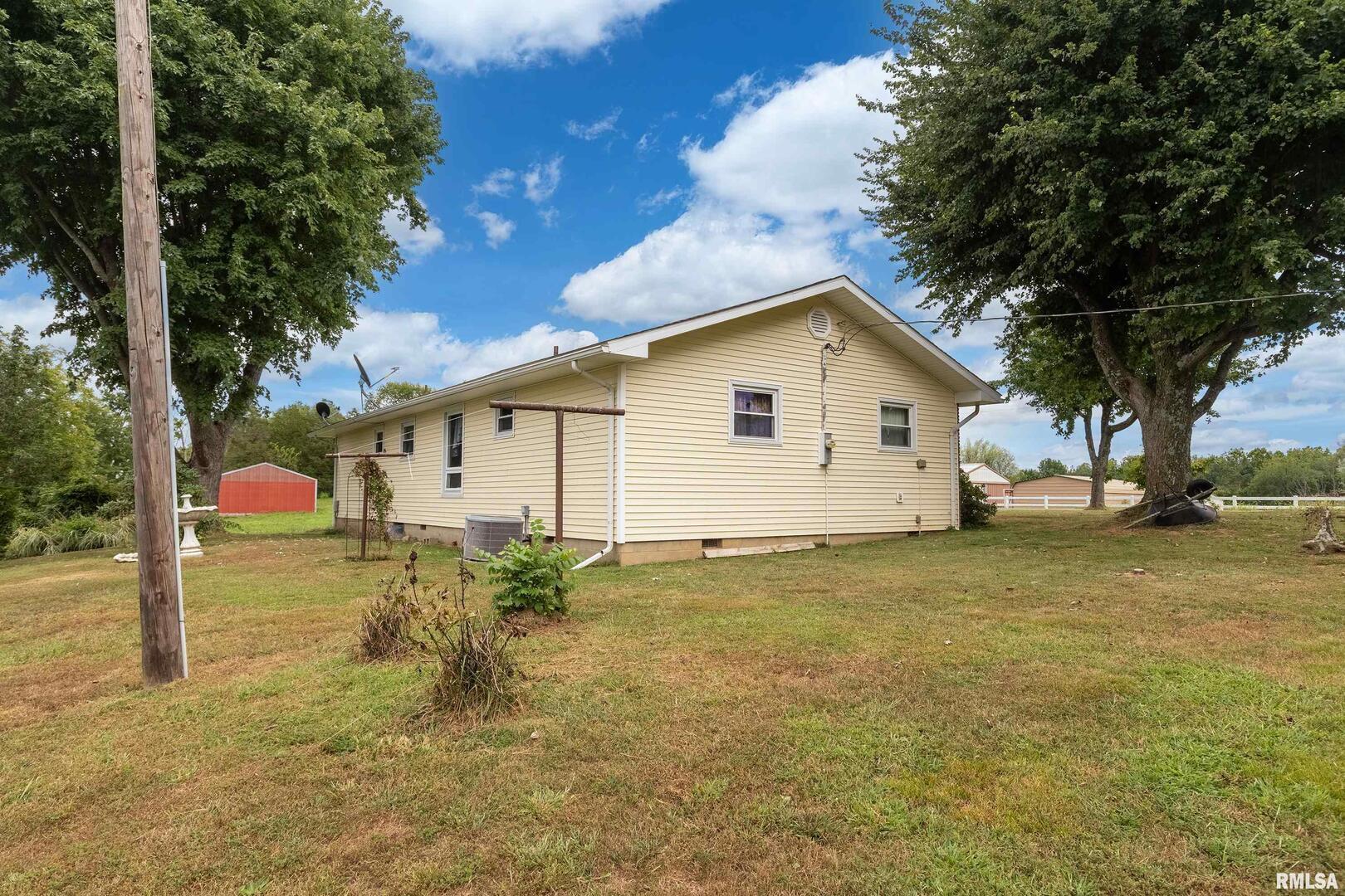 16768 Boundary Road Creal Springs, IL 62922 - Photo 14 of 21 a view of a backyard with large trees