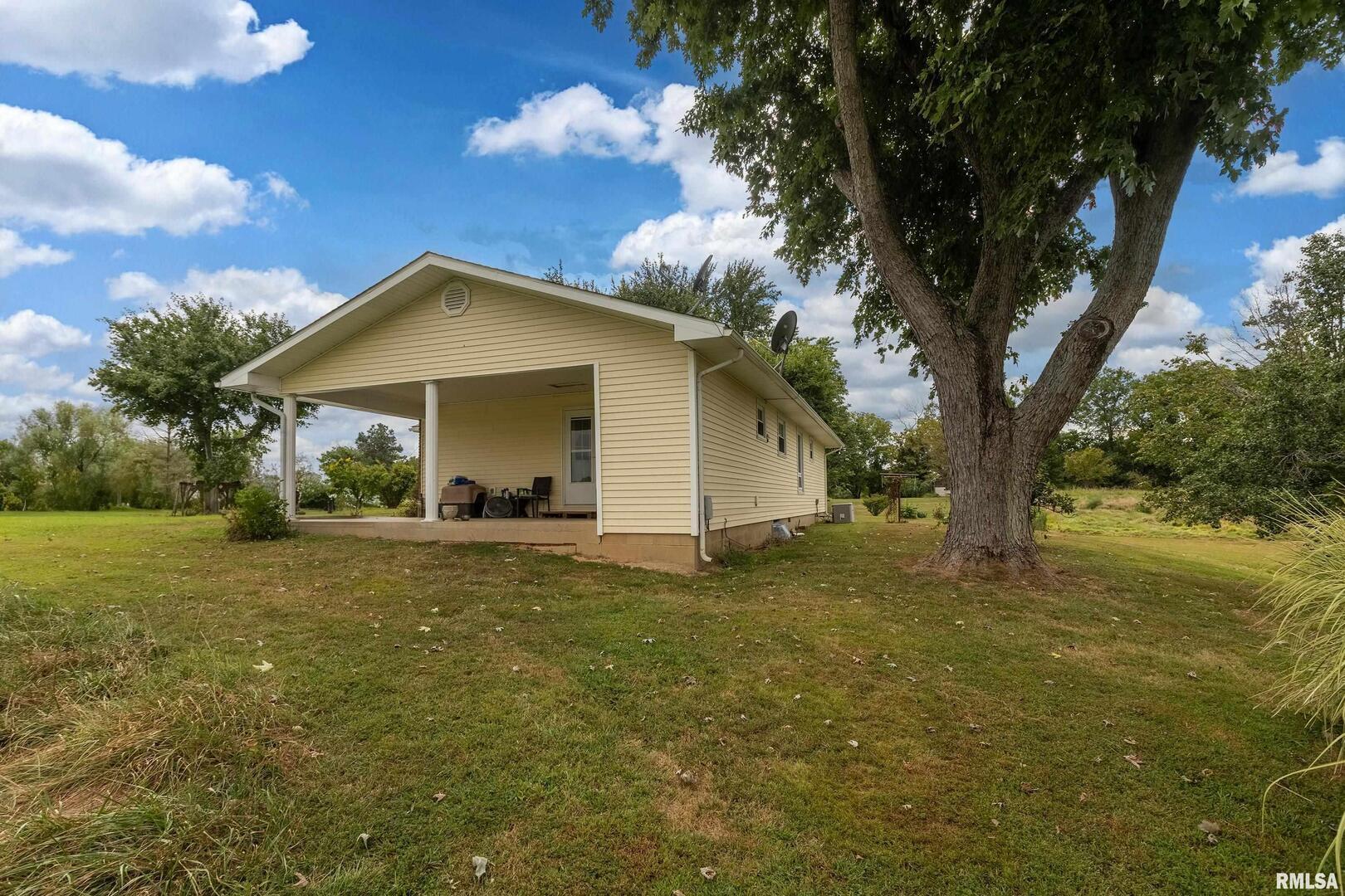 16768 Boundary Road Creal Springs, IL 62922 - Photo 15 of 21 a view of a house with a yard