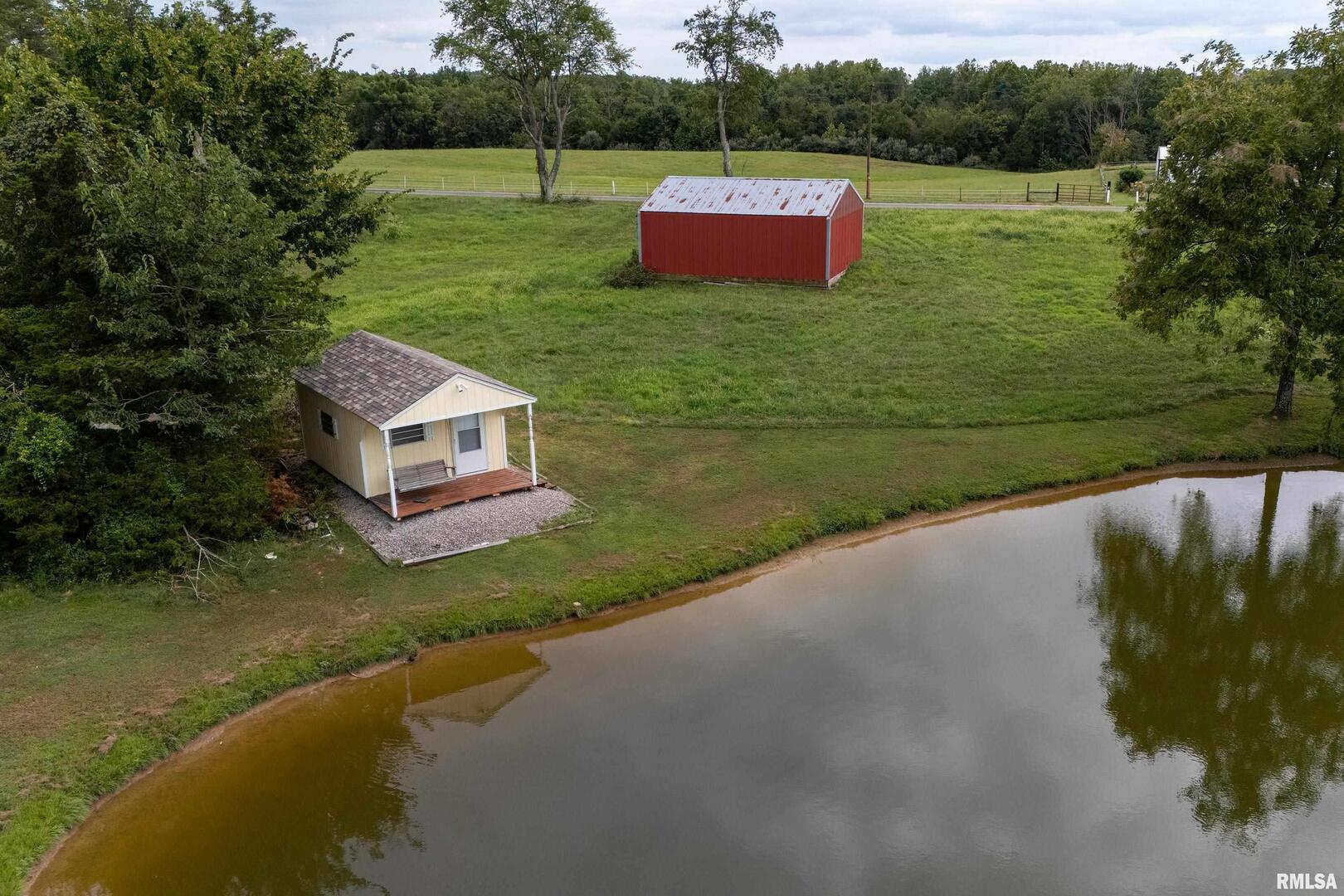 16768 Boundary Road Creal Springs, IL 62922 - Photo 21 of 21 a view of a house with a yard