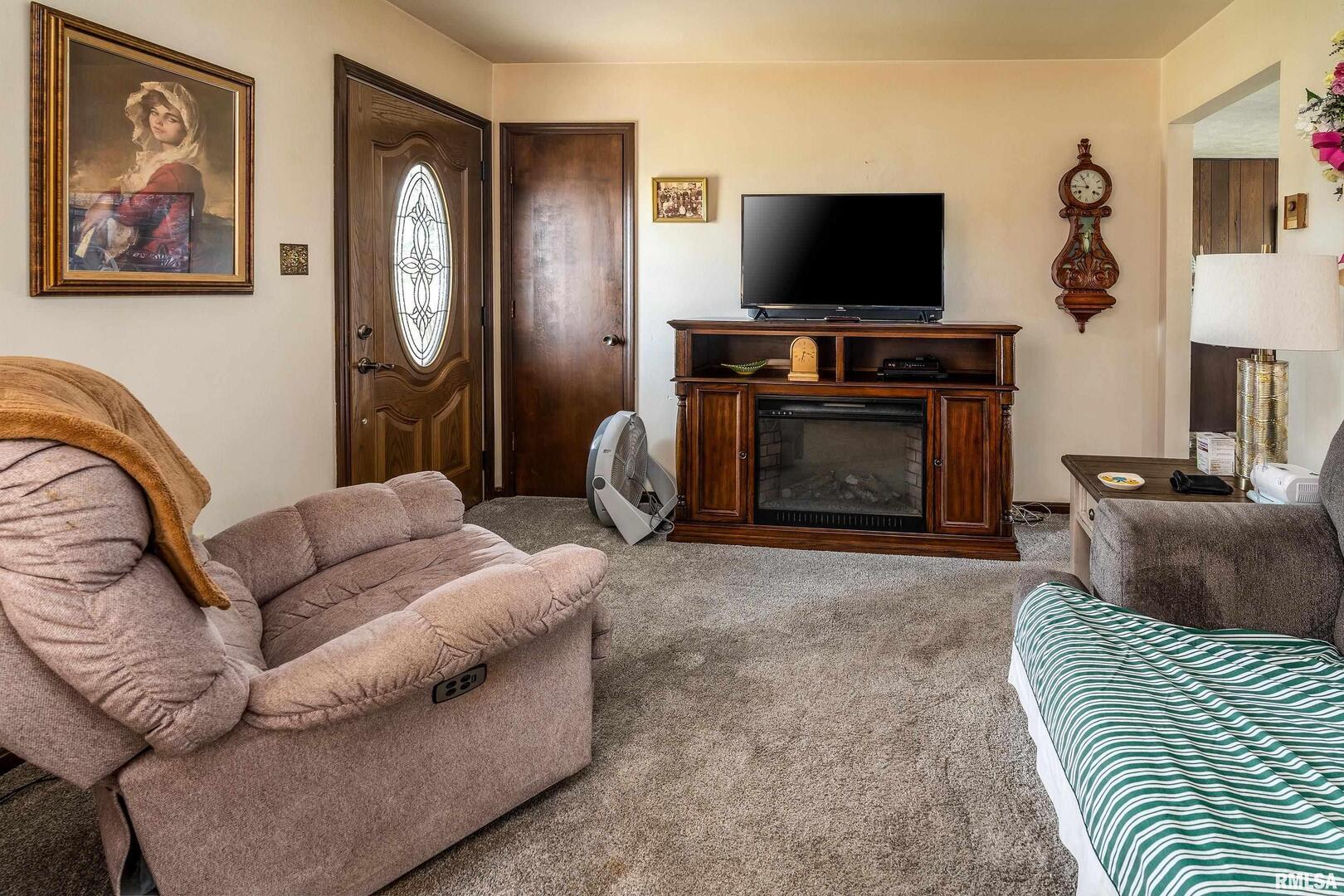 16768 Boundary Road Creal Springs, IL 62922 - Photo 3 of 21 a living room with furniture and a flat screen tv
