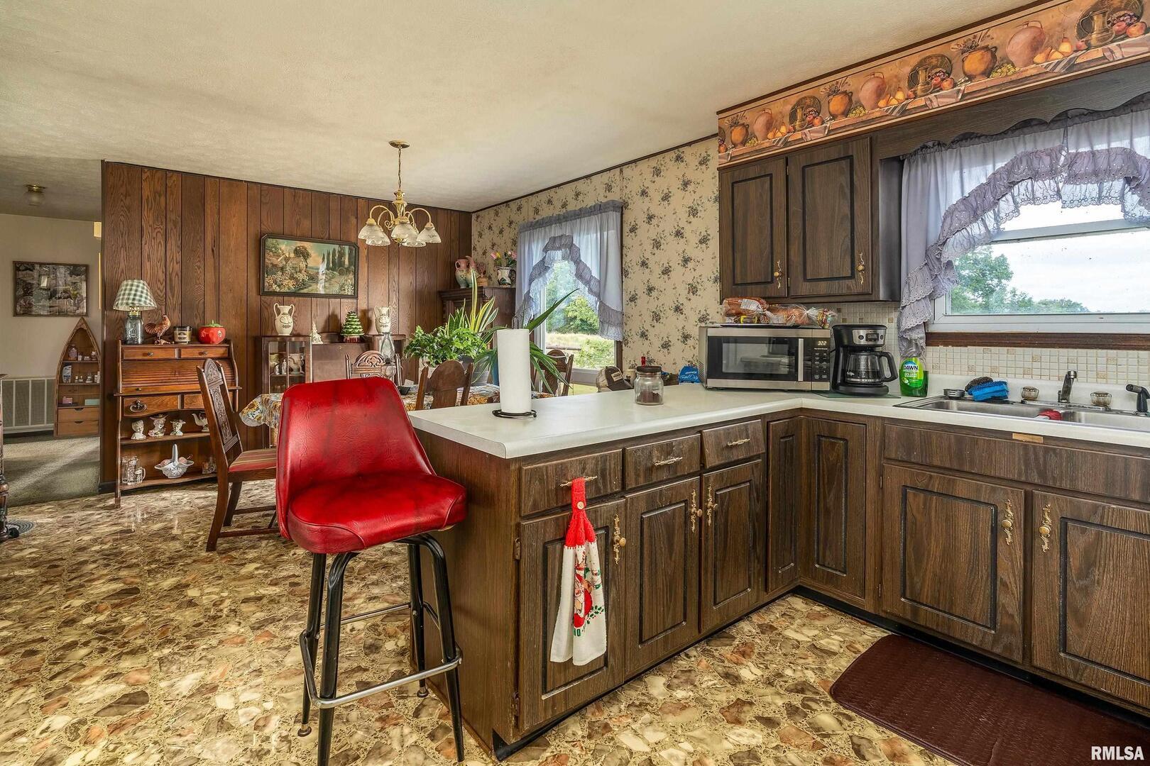 16768 Boundary Road Creal Springs, IL 62922 - Photo 8 of 21 a kitchen with stainless steel appliances granite countertop a sink dishwasher stove and cabinets