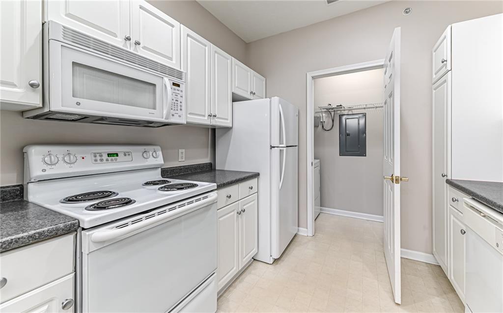 1012 Stockton Ridge Cranberry Township, PA 16066 - Photo 16 of 32 a kitchen with stainless steel appliances granite countertop a refrigerator stove and white cabinets