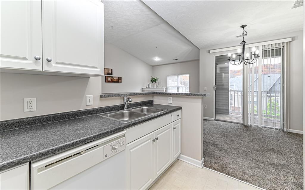 1012 Stockton Ridge Cranberry Township, PA 16066 - Photo 17 of 32 a kitchen with granite countertop a sink and cabinets