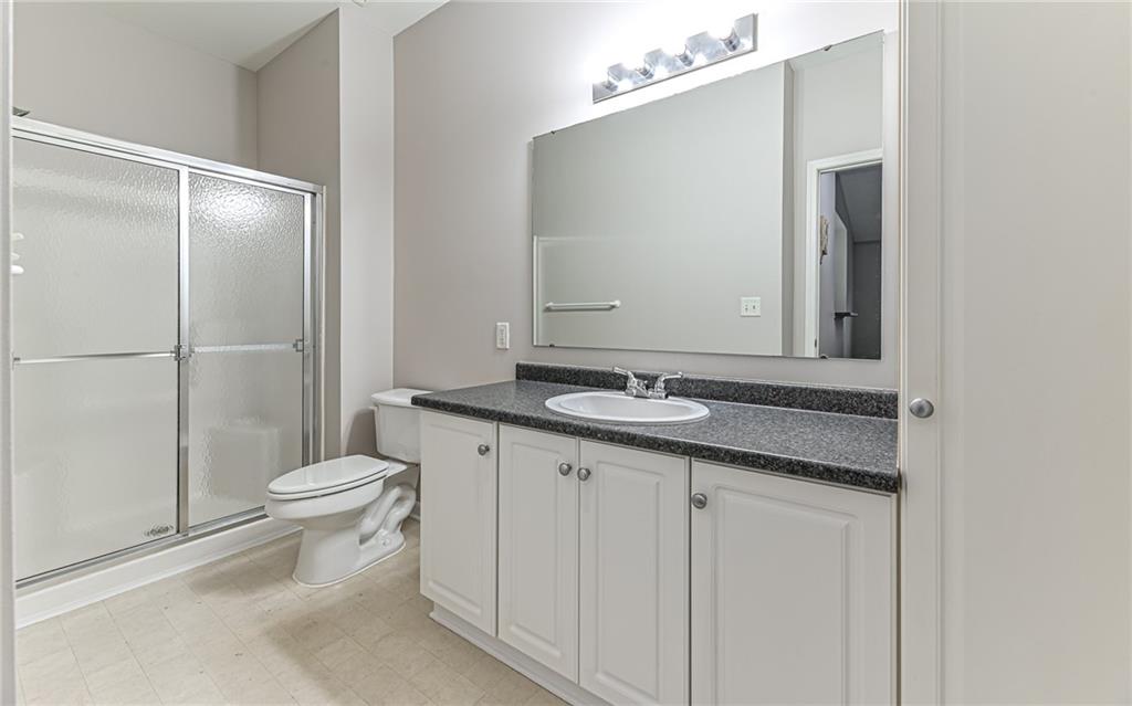 1012 Stockton Ridge Cranberry Township, PA 16066 - Photo 23 of 32 a bathroom with a granite countertop sink toilet and shower