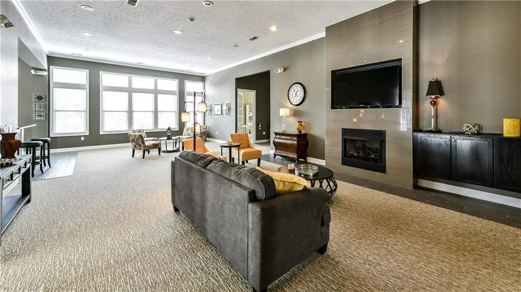 1012 Stockton Ridge Cranberry Township, PA 16066 - Photo 26 of 32 a living room with furniture a flat screen tv and a fireplace