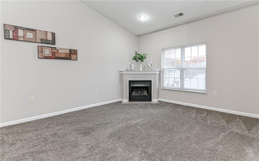 1012 Stockton Ridge Cranberry Township, PA 16066 - Photo 7 of 32 an empty room with windows and fireplace