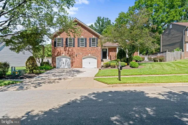 a front view of a house with a yard and porch