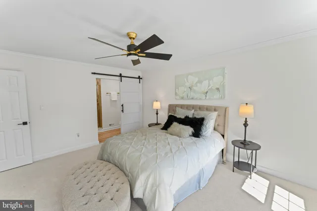 a bedroom with a bed and a table