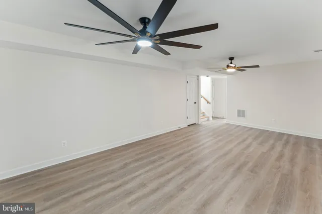 a bedroom with a bed and a lamp