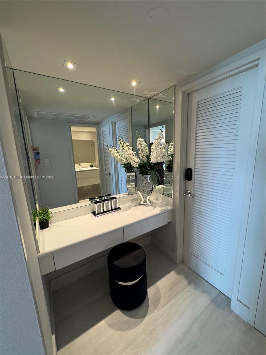 5151 Collins Avenue, Unit 726 Miami Beach, FL 33140 - Photo 15 of 32 a kitchen with a sink and a refrigerator