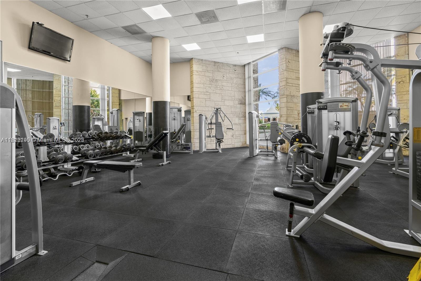 5151 Collins Avenue, Unit 726 Miami Beach, FL 33140 - Photo 22 of 32 a view of a room with gym equipment