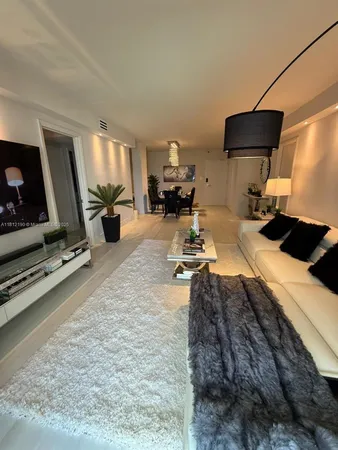 a bed room with a bed and a flat screen tv