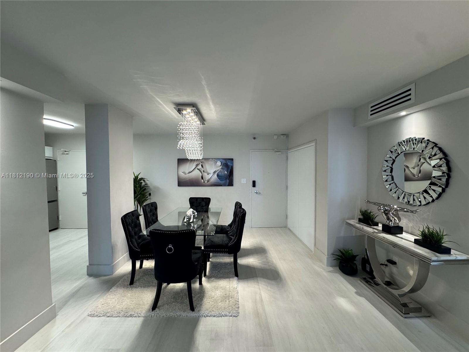 5151 Collins Avenue, Unit 726 Miami Beach, FL 33140 - Photo 10 of 32 a view of a dining room with furniture