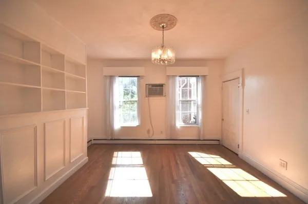 a view of entryway with wooden floor and window