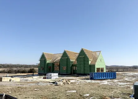 a view of swimming pool with a patio and wooden fence