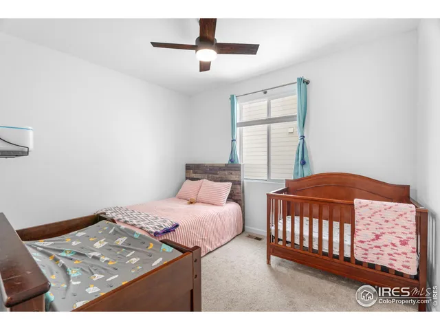 a bedroom with a bed and a view of bedroom