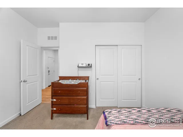 a room with a dresser and a mirror